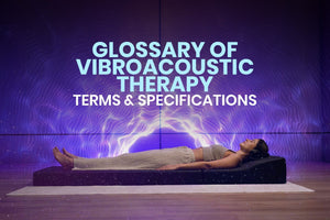 Person lying on a vibroacoustic therapy mat with 'Glossary of Vibroacoustic Therapy Terms & Specifications' text on a screen.